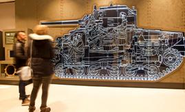 Two adults viewing York Army Museum Tank